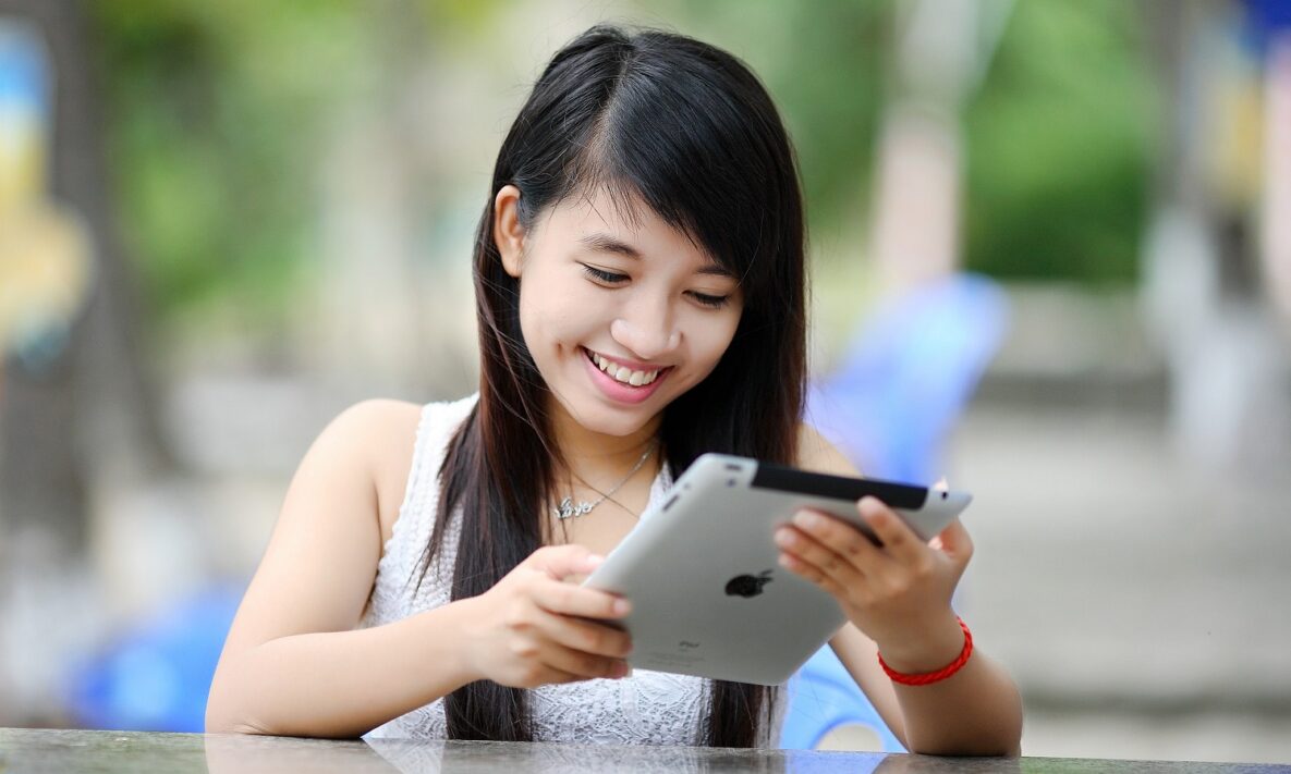 A young woman with an iPad.