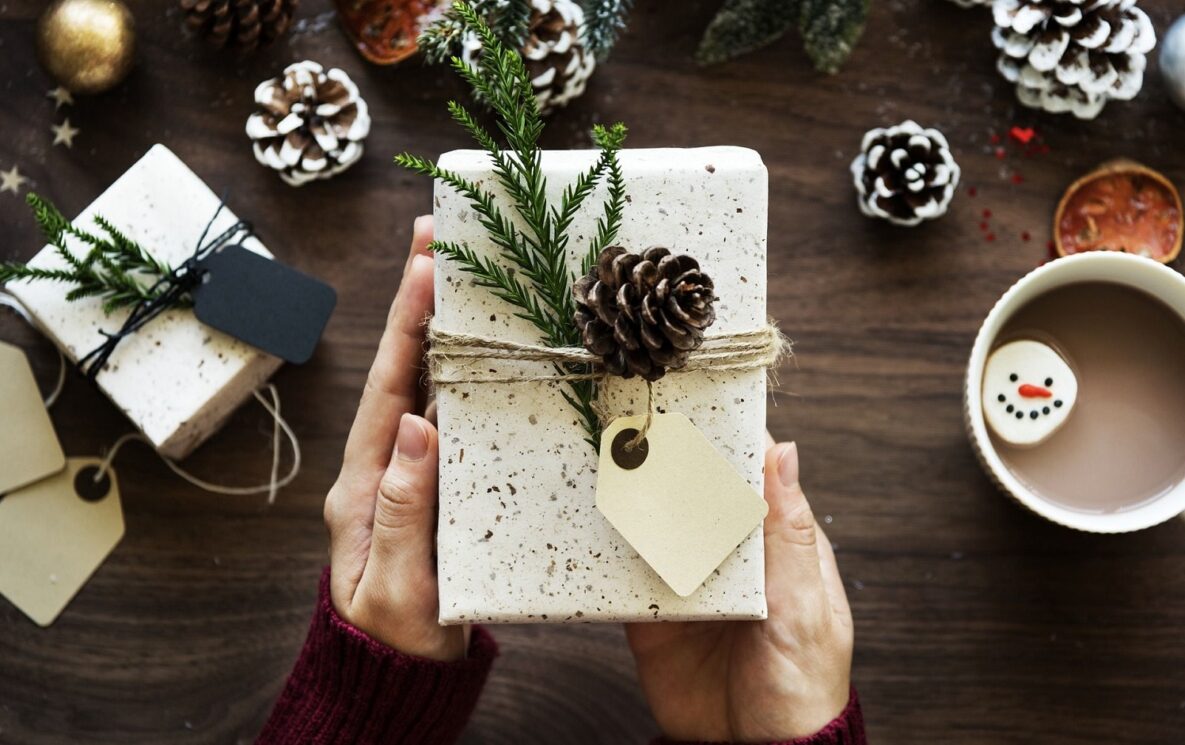 A set of hands holding a present.