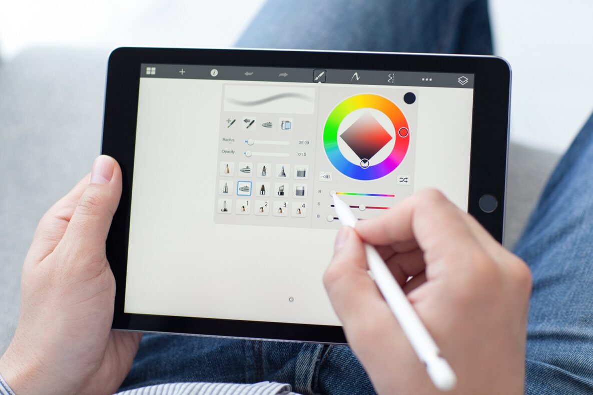 A person using an Apple Pencil.
