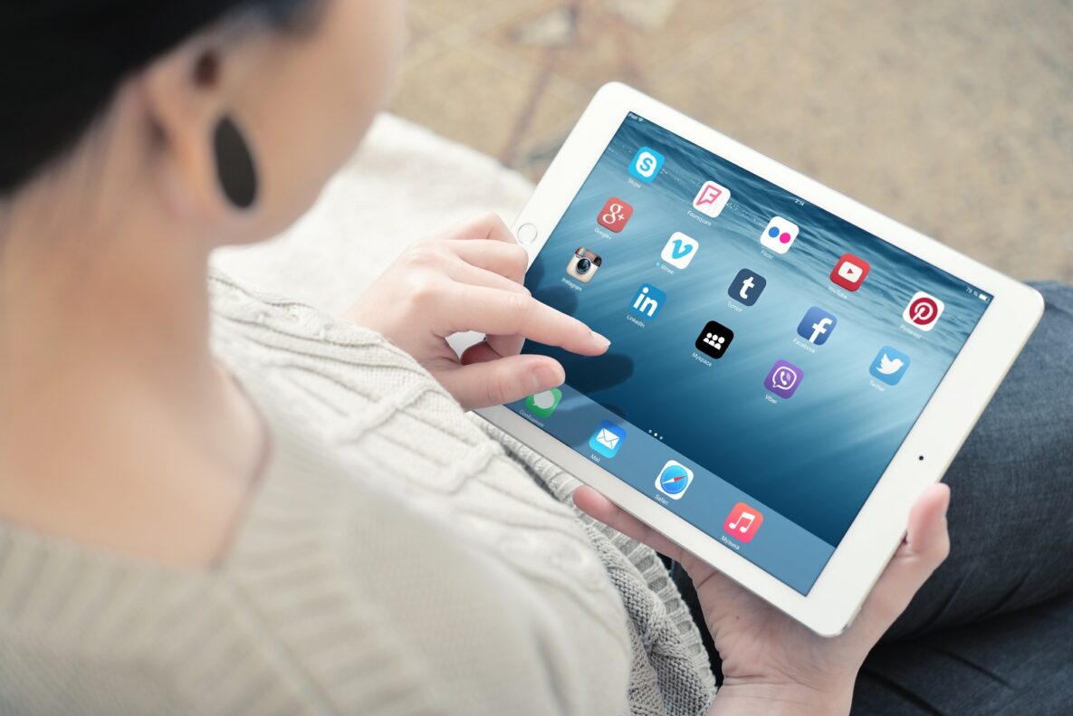 A woman using a tablet.