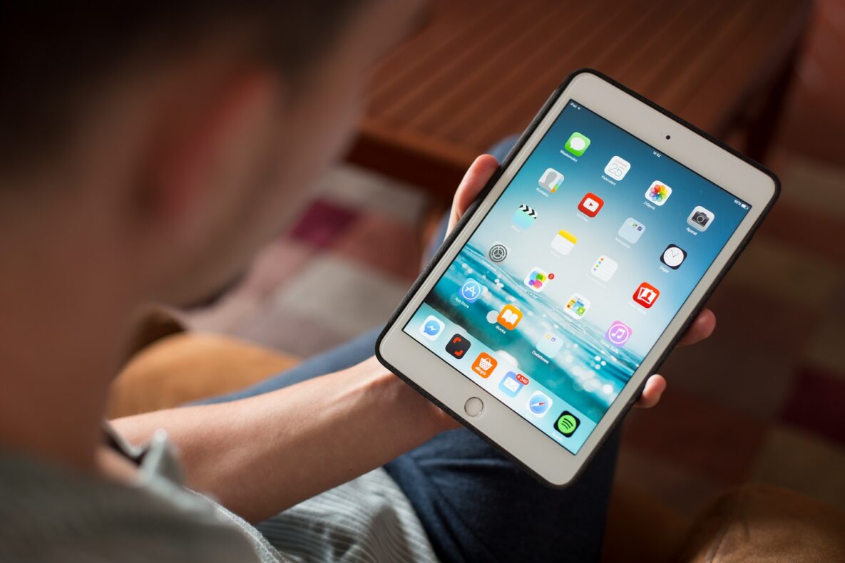 A man using an iPad.