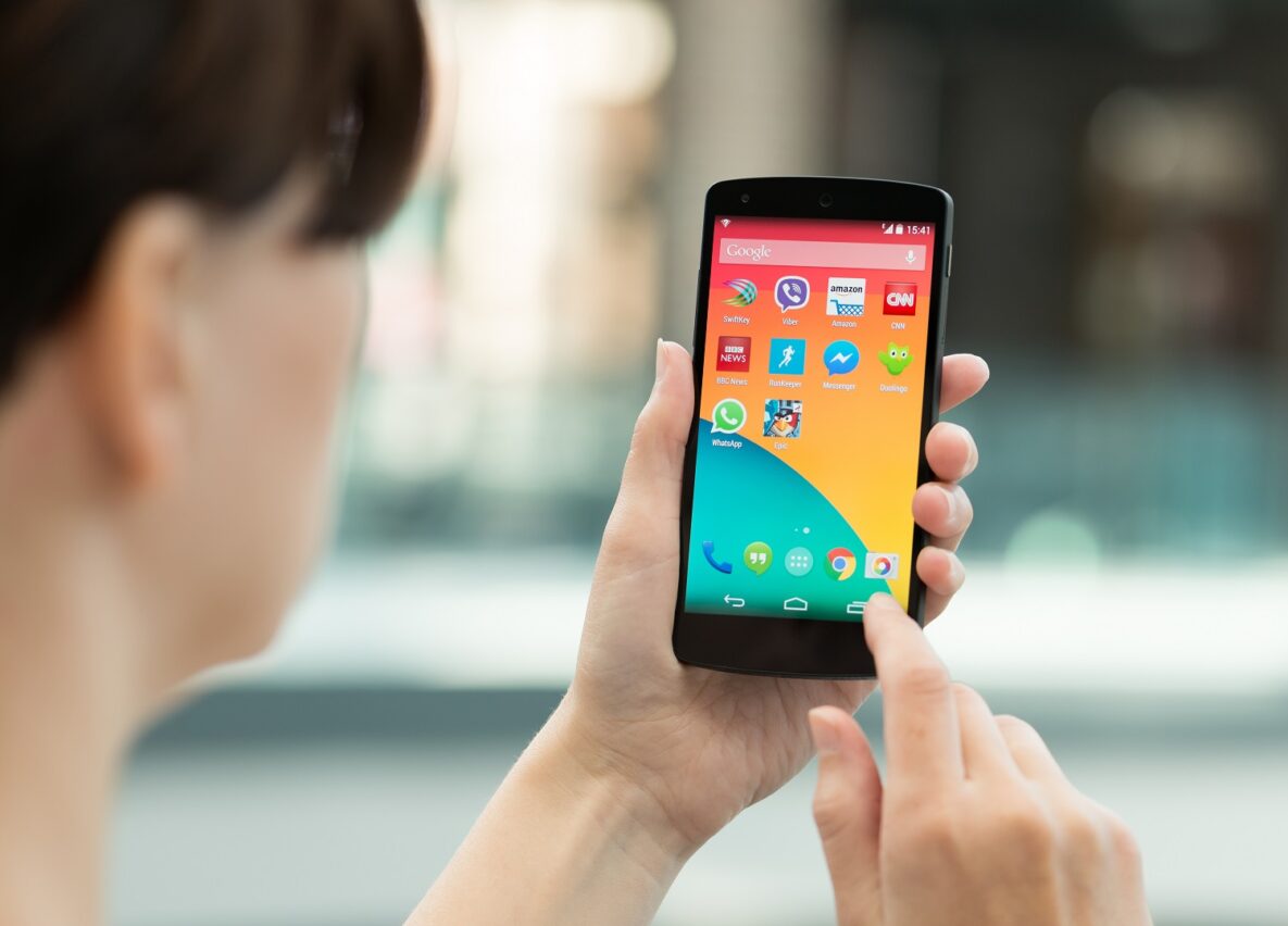 A woman using an android phone.