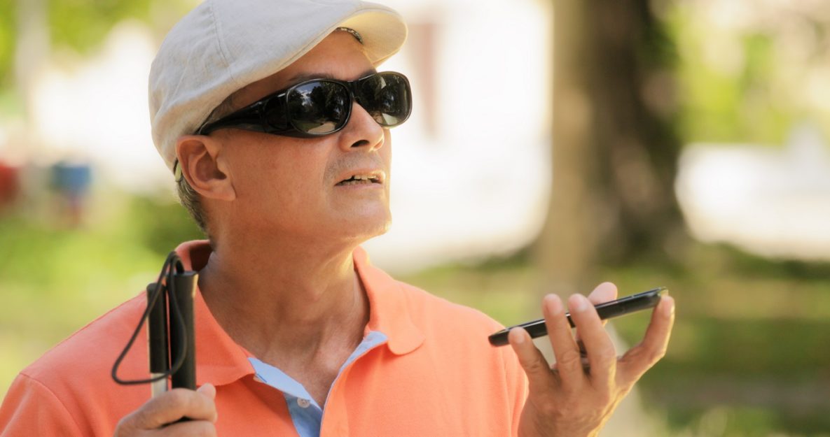 A blind man using a smartphone.
