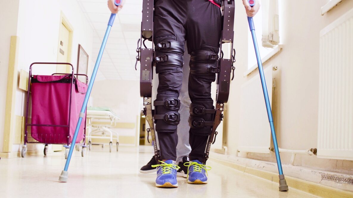 A man using an exoskeleton to walk.