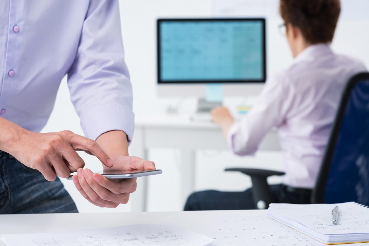 A man using his phone to capture an OCR image.