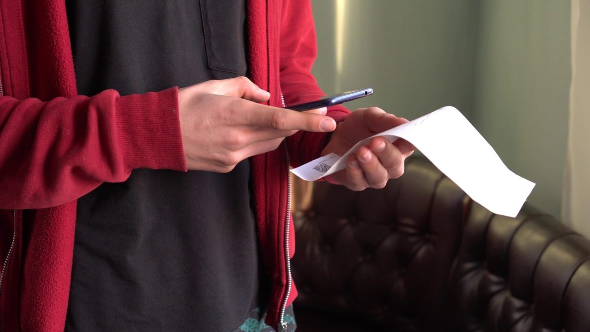 Using a smartphone to scan a receipt.