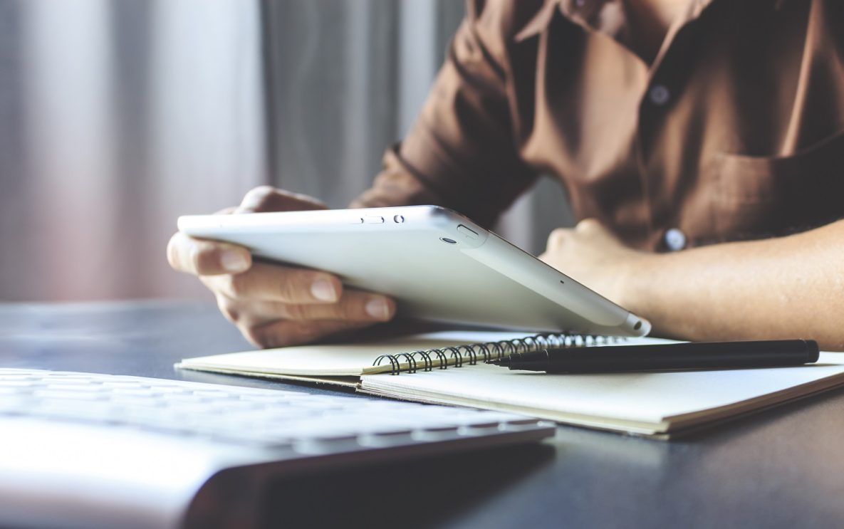 A man using a tablet.