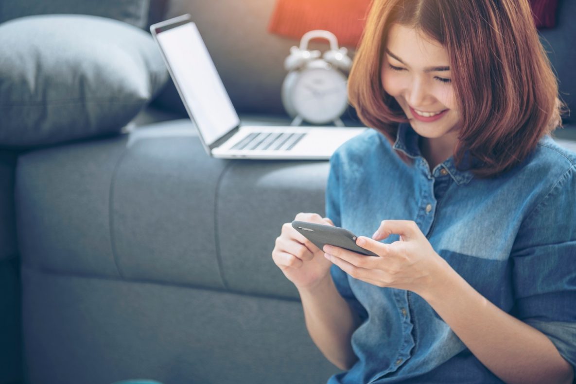 A young woman using a smartphone.