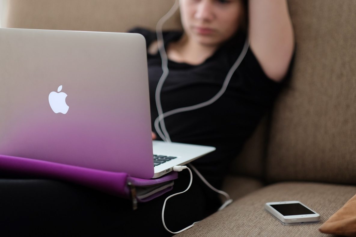 A young woman using a laptop.