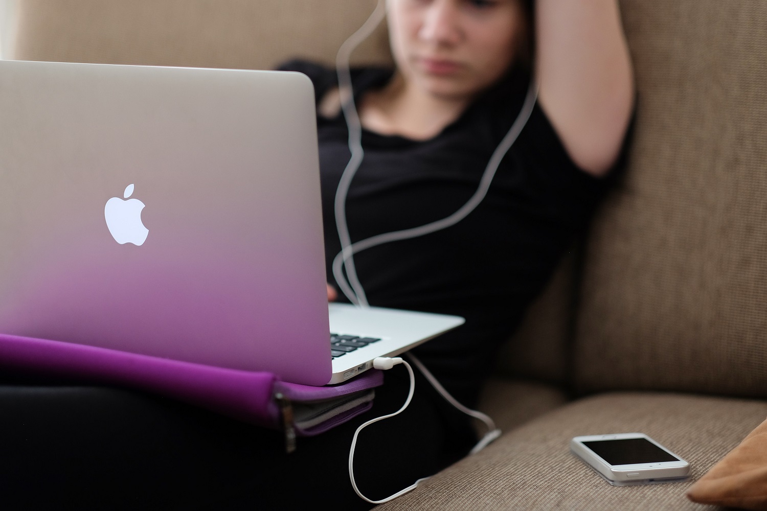 A young woman using a laptop