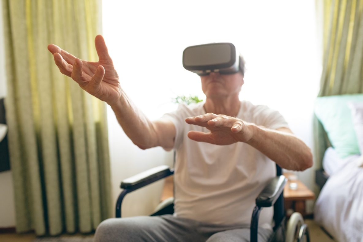 An elderly man using a VR headset.
