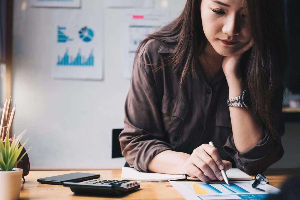 A woman working on a math problem.