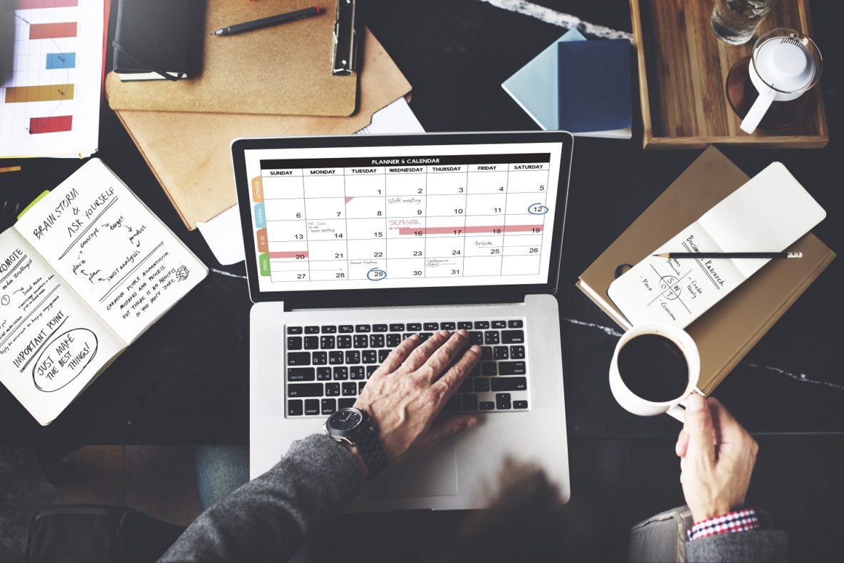 A person using a digital calendar.