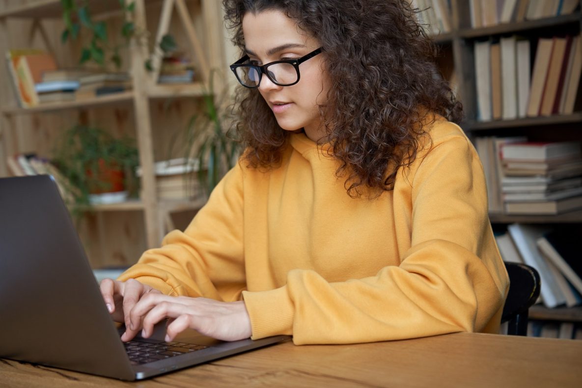 A student studying on her laptop.