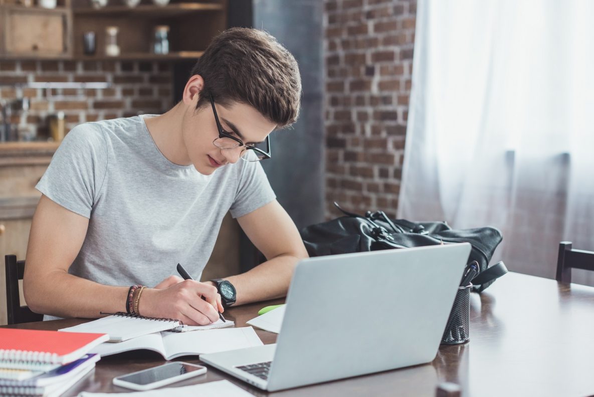 A student studying on his laptop.