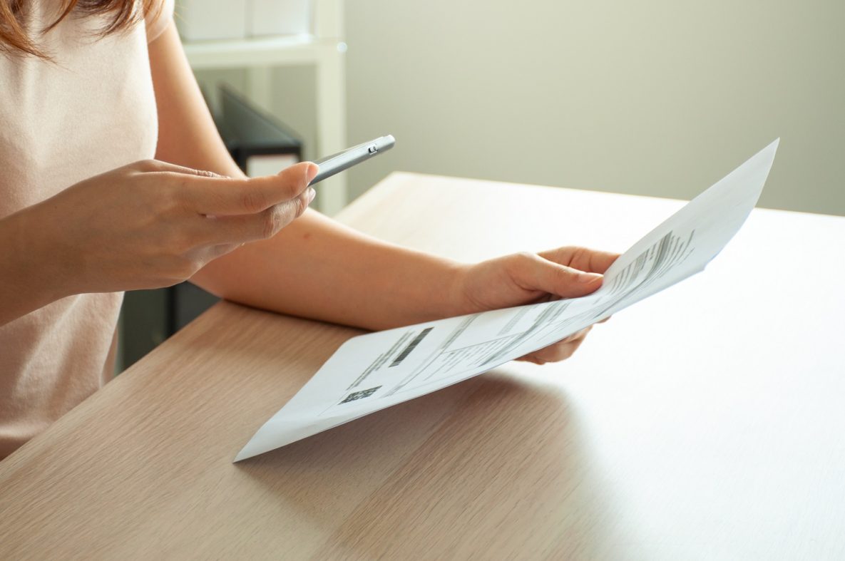 Woman using smartphone to scan.
