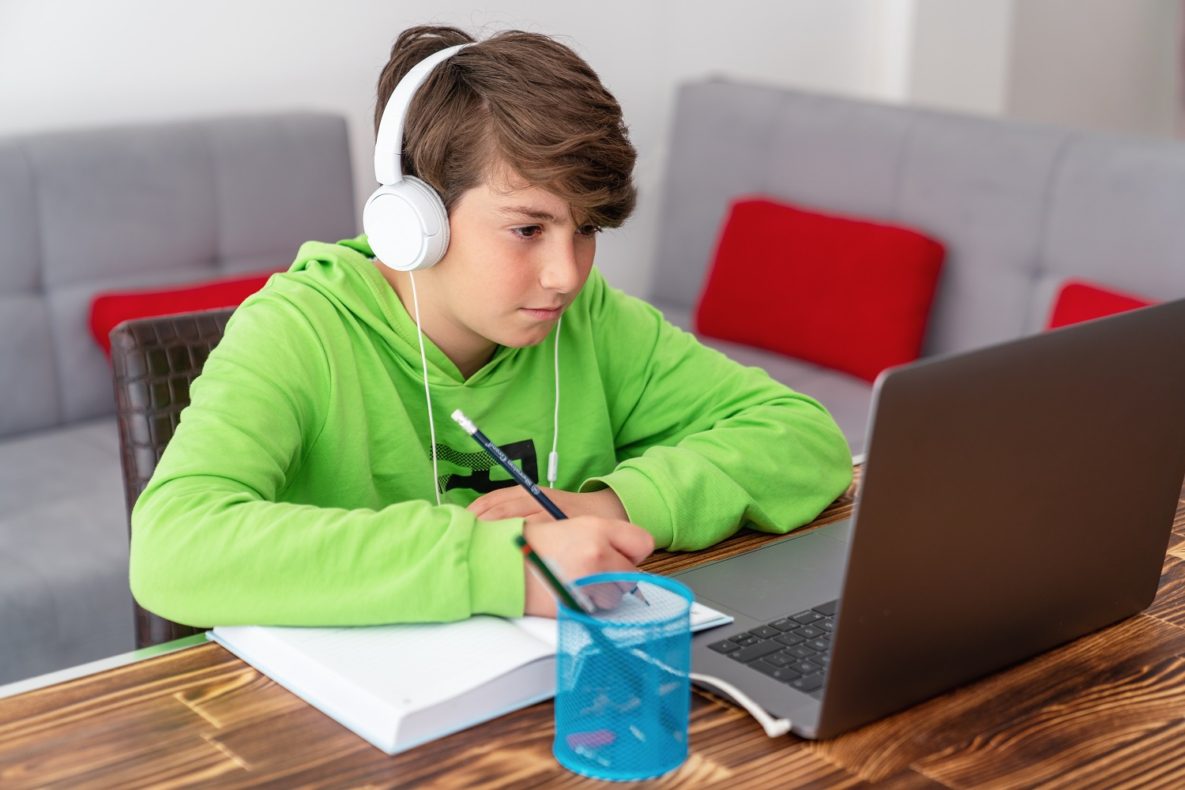 A student studying on his laptop.