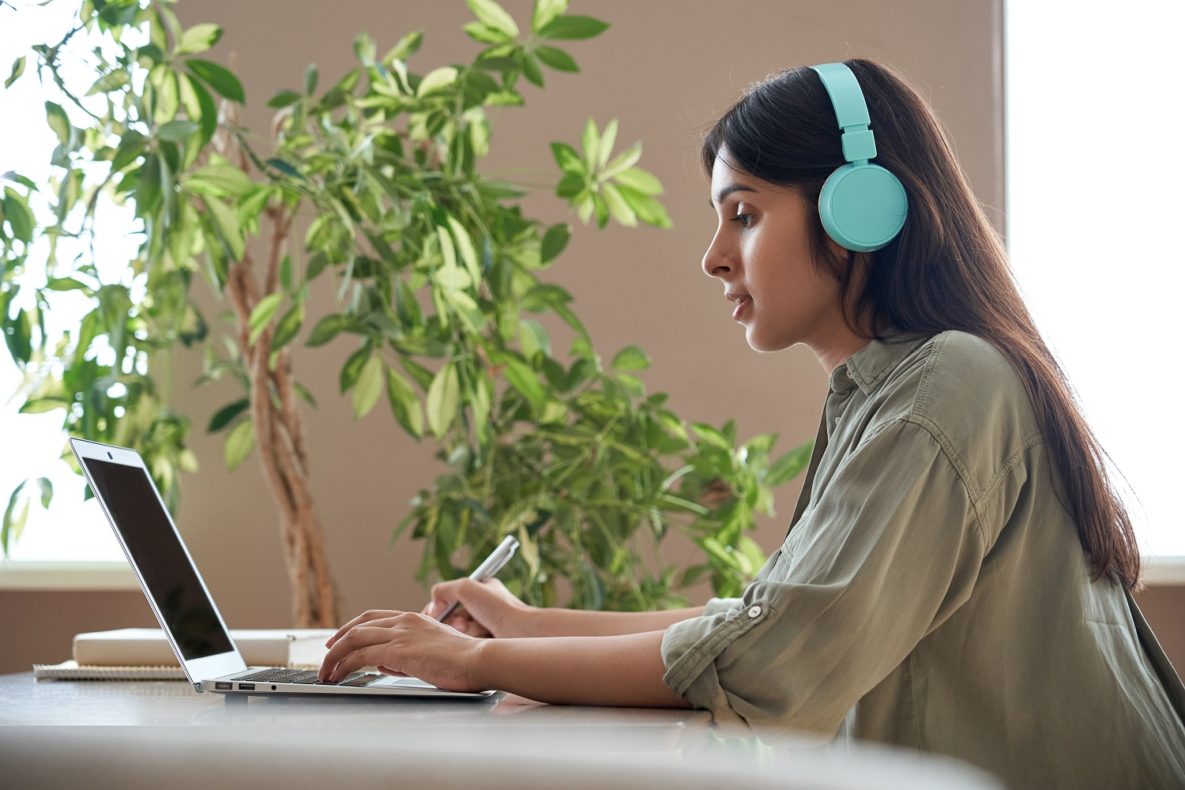 A student studying with headphones.