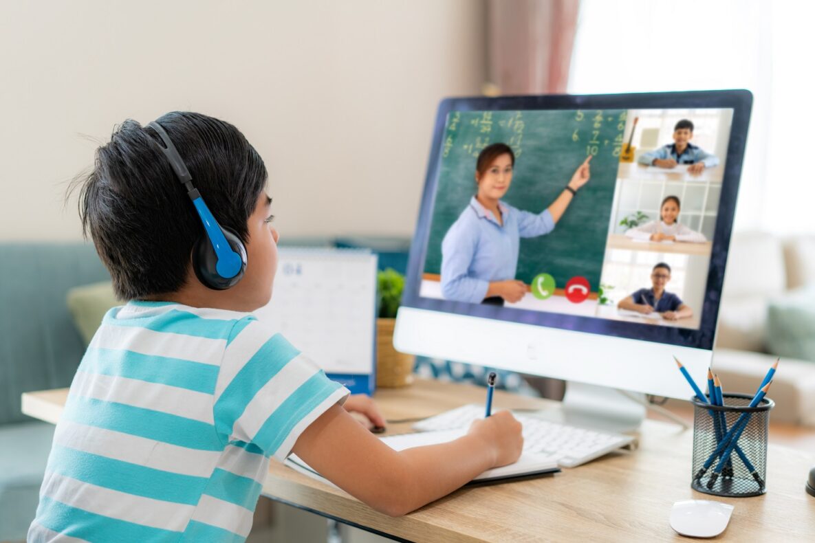 A boy attending a virtual class.