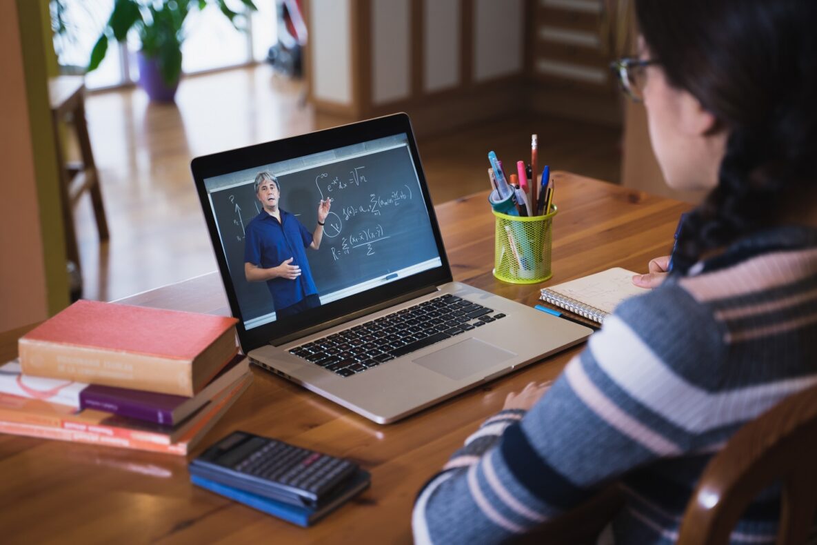 A young woman learning math online.
