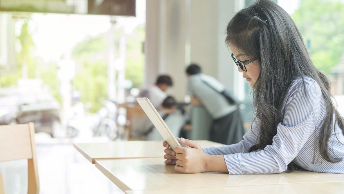 A girl using her tablet.