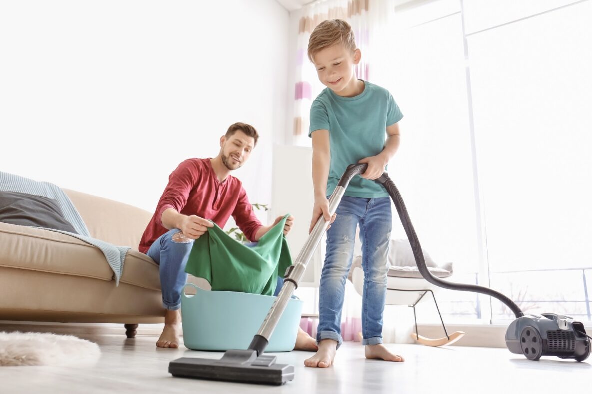 A boy and his father cleaning.