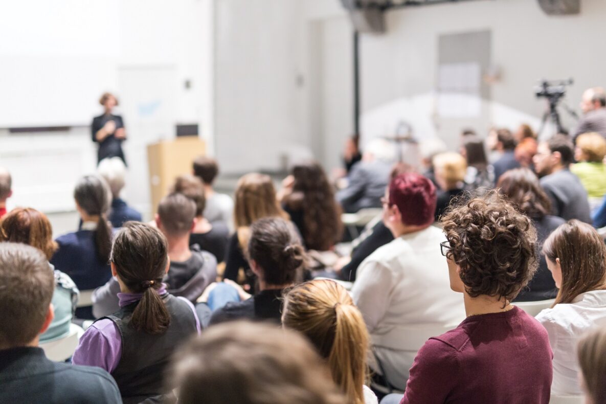 A woman giving a presentation.
