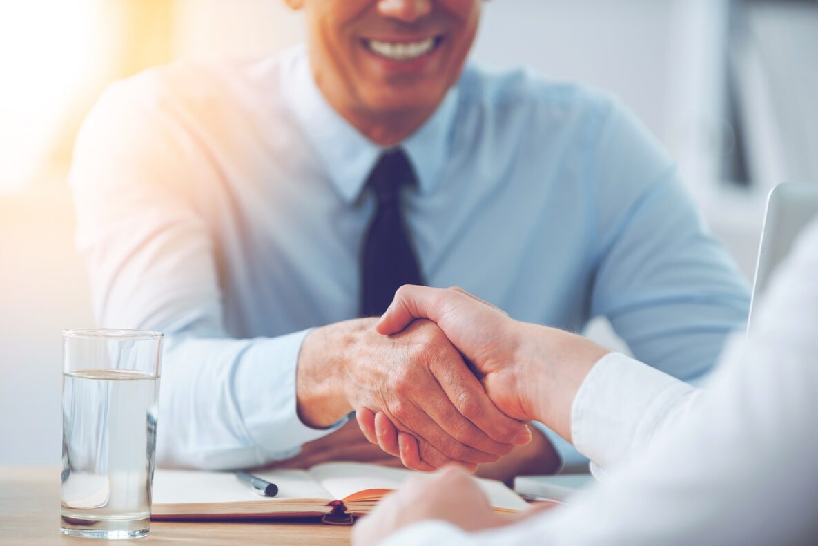 Two people shaking hands.