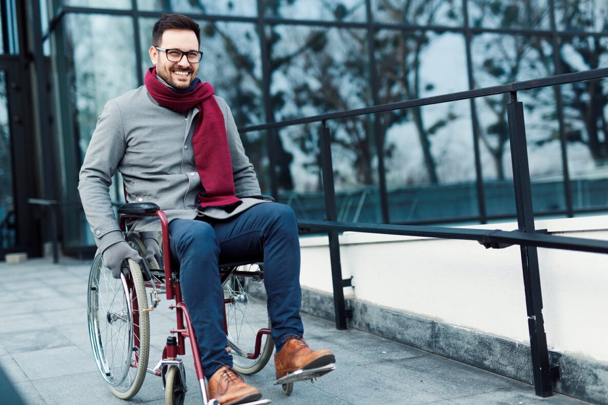 A man outside in a wheelchair.