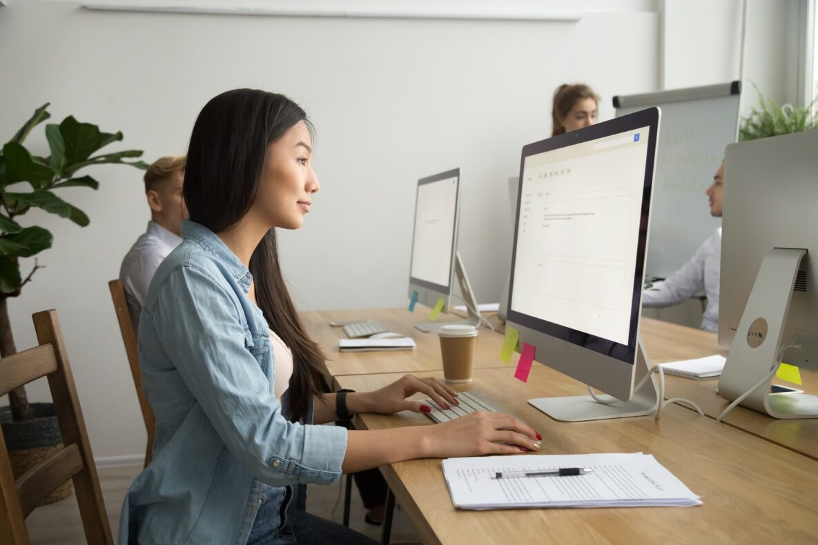 A group of people at work using their computers.
