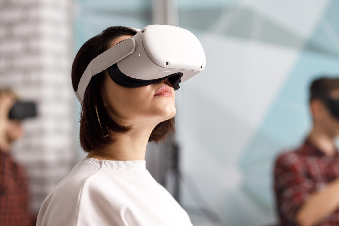 A woman using a VR headset.