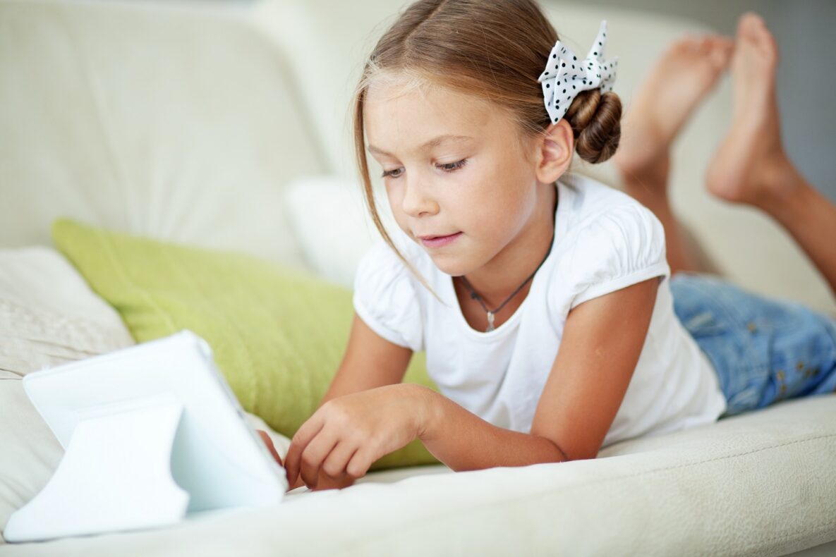 A child using her tablet.