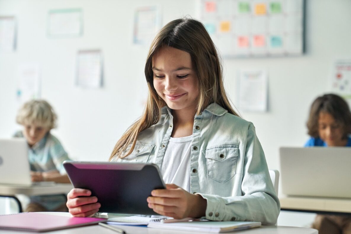 A student in class using her tablet.