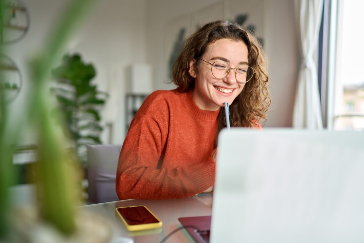 A young student using her laptop.