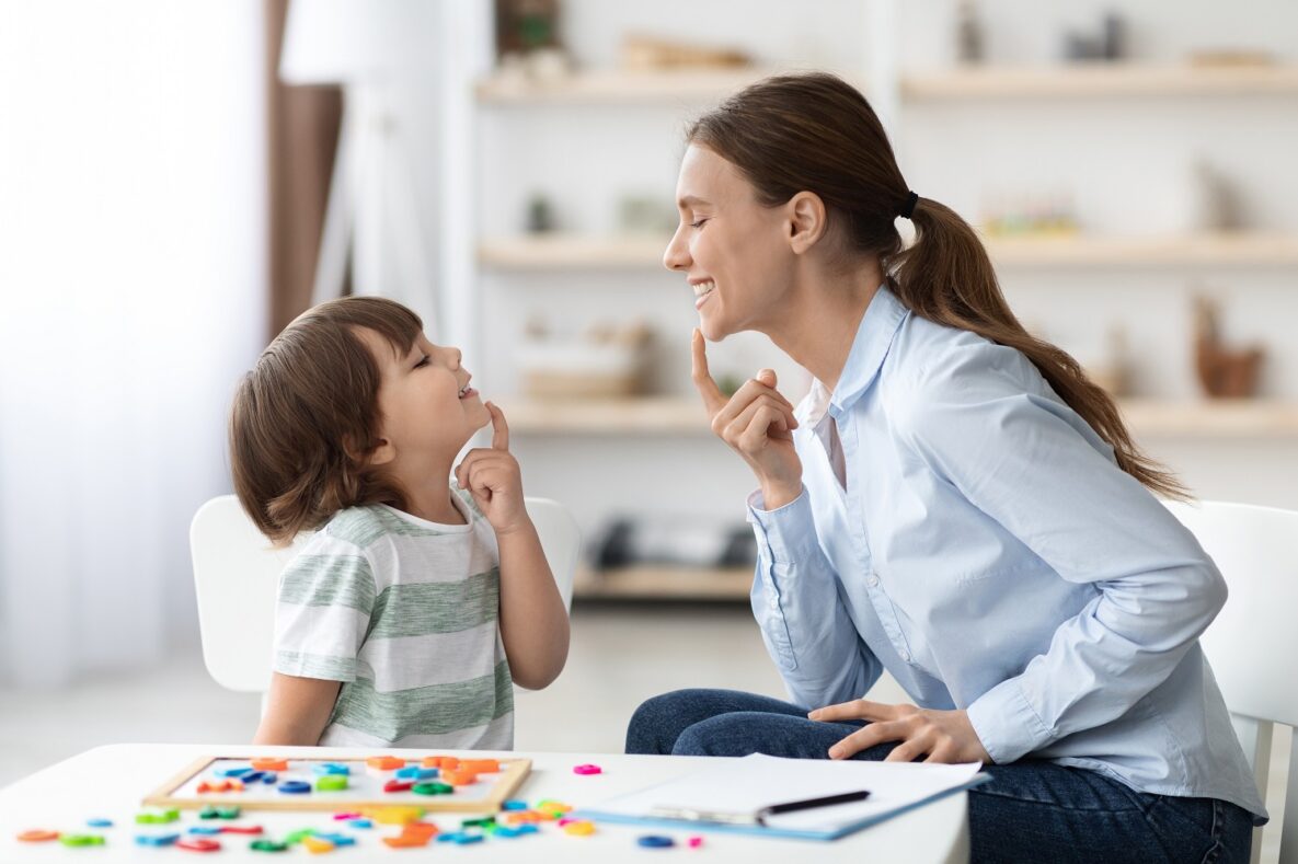 A speech-language pathologist and her student.