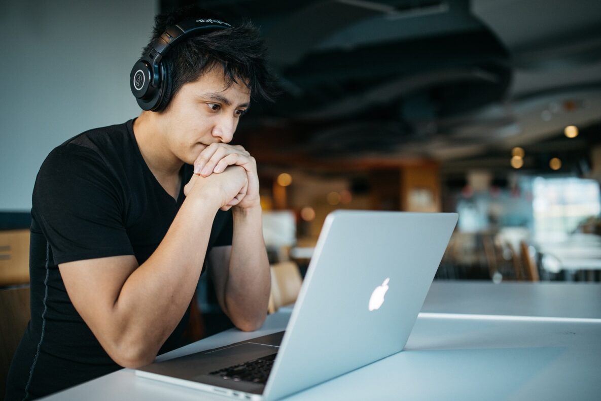 A man using his laptop to study.