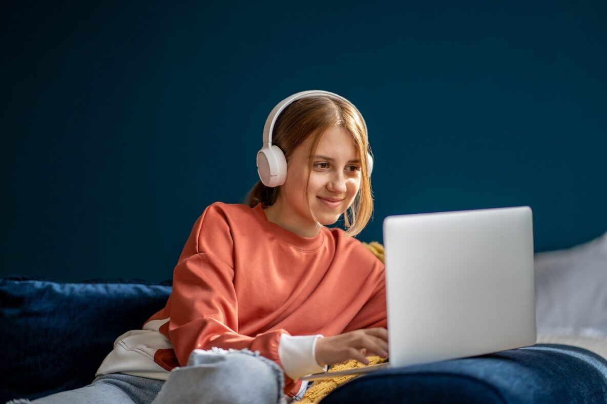 A young woman using her laptop at home.