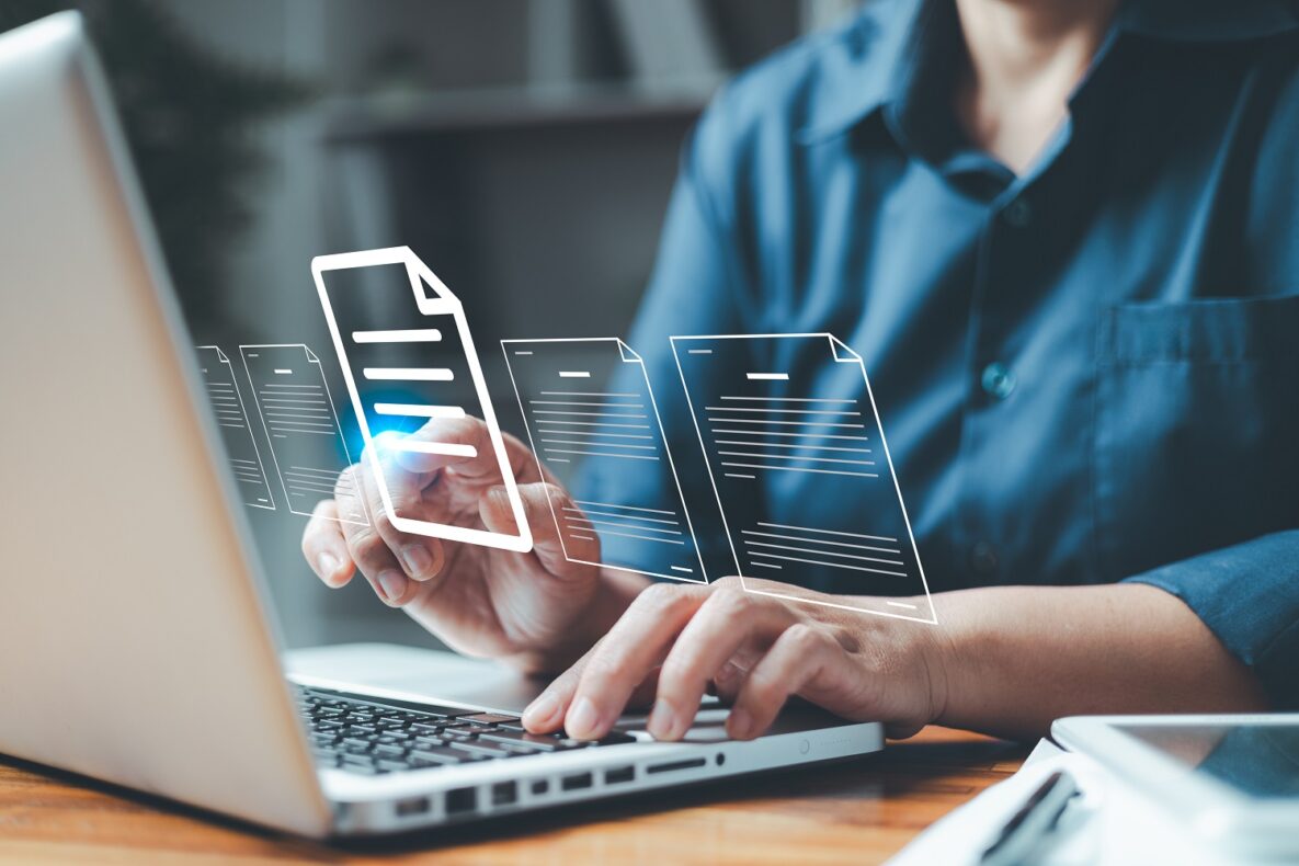 A person using a laptop at work.
