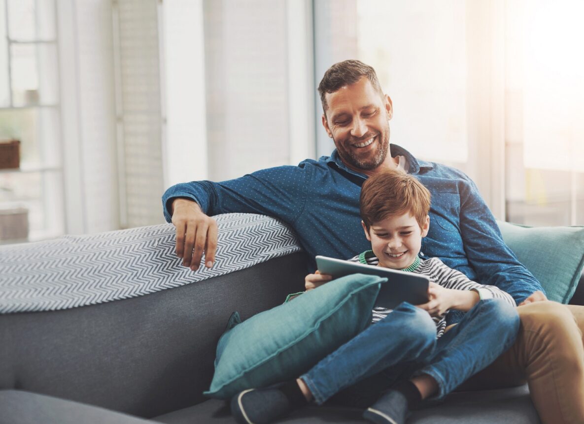 Father and son on their tablet.