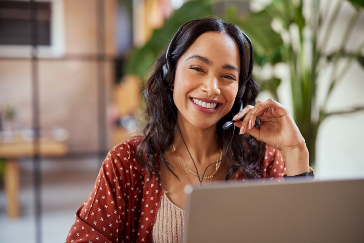 Portrait of smiling business woman with headset.