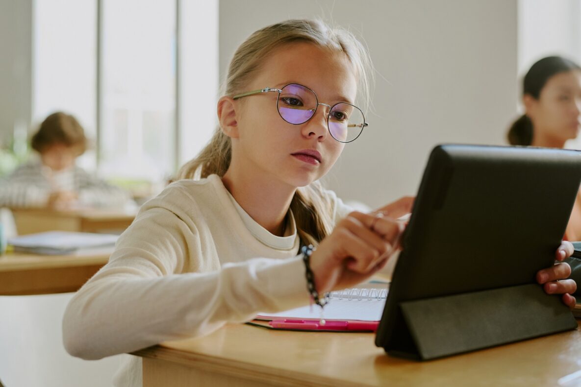 Girl Using Tablet Device in Class