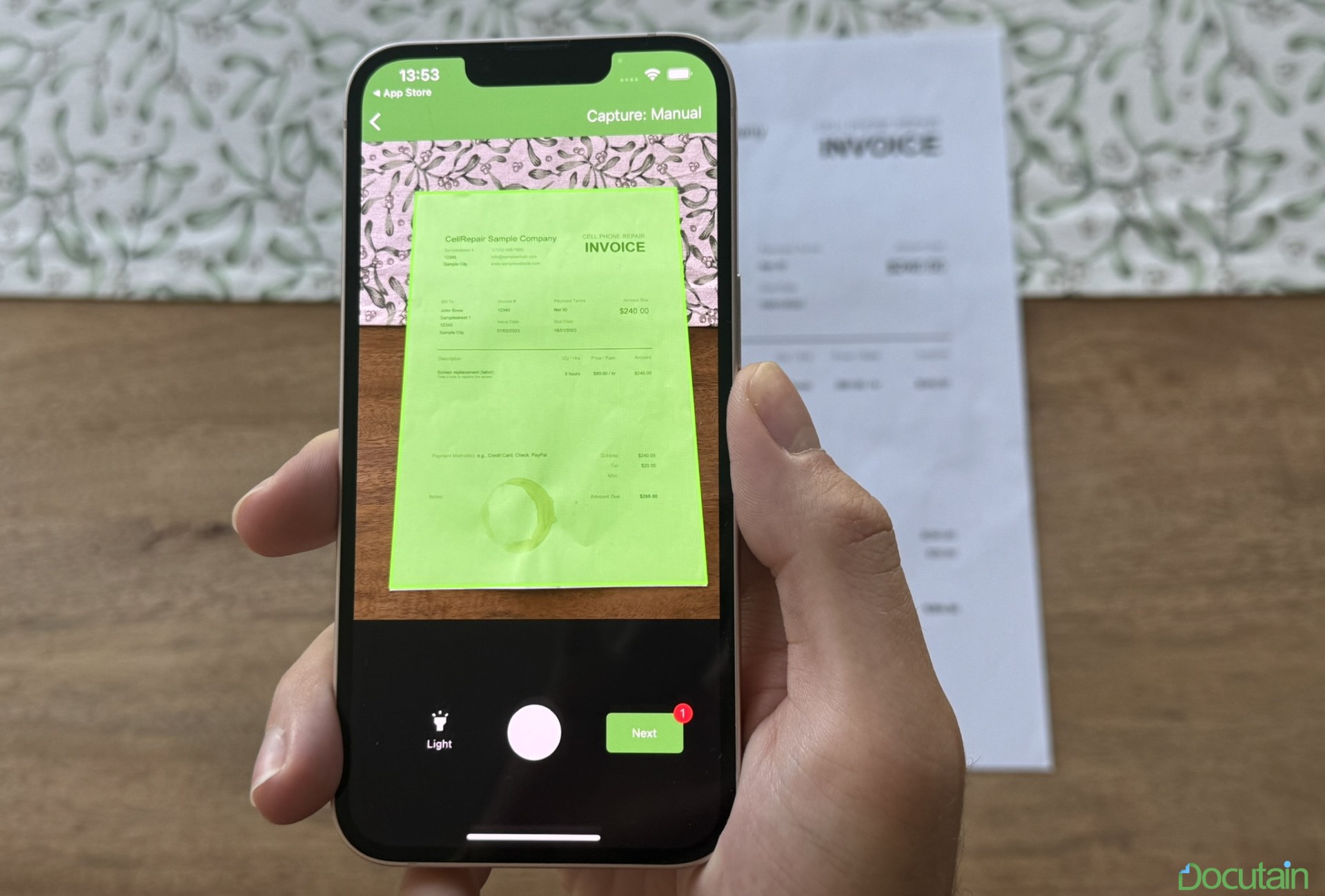 An image of a person scanning a document with Docutain