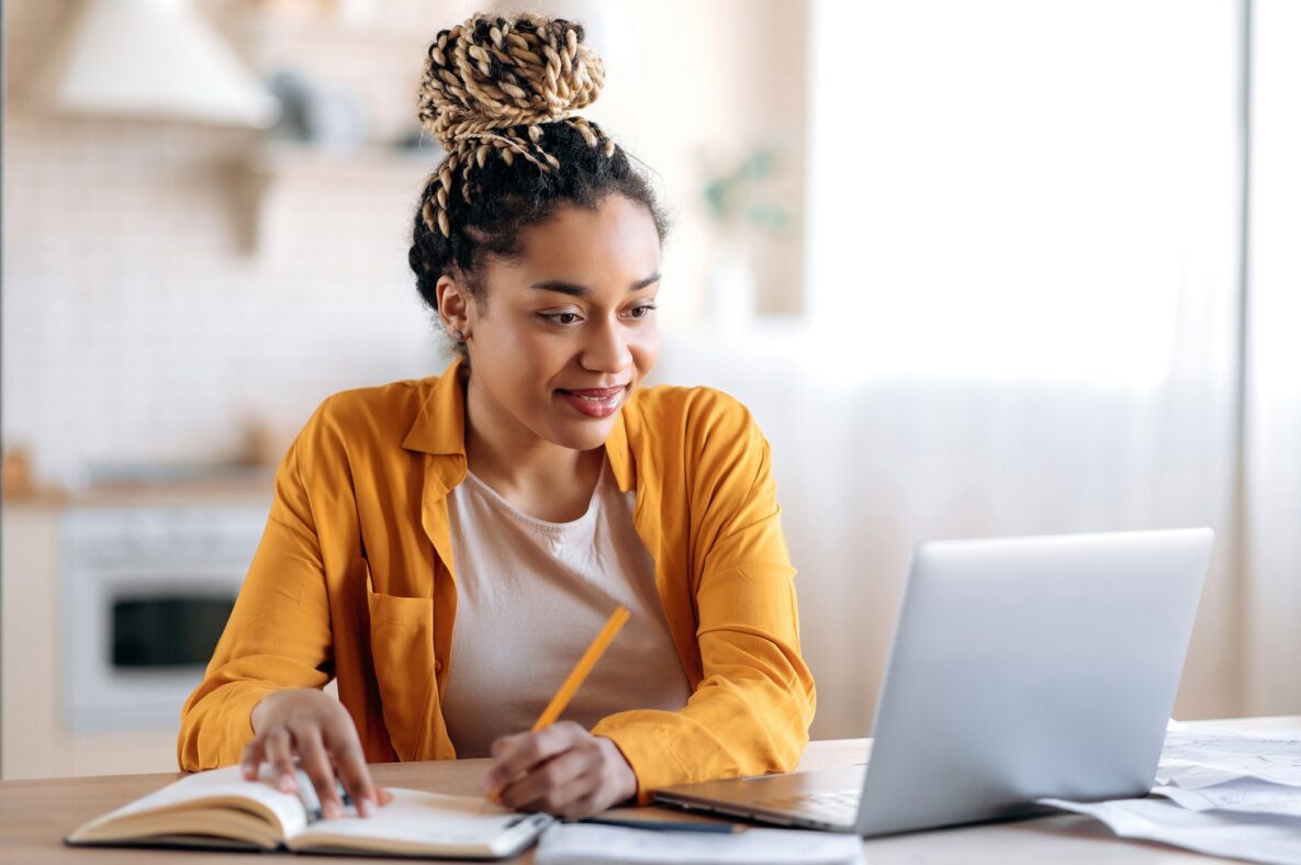 Focused female student studying remotely