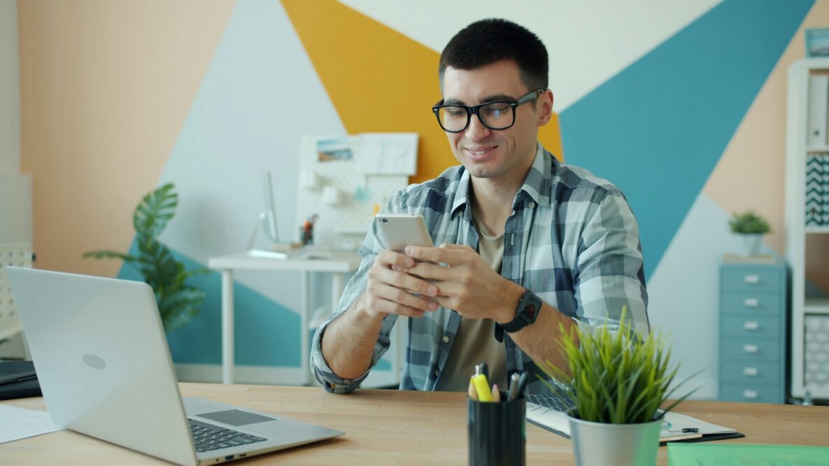 a man using his phone at work
